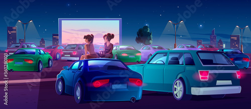 Girls at car cinema. Couple of friends in drive-in theater with automobiles stand in open air city parking at night. Women sit on auto roof watching movie, eating popcorn, Cartoon vector illustration