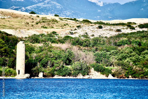 lighthouse caska beach on pag island croatia photo