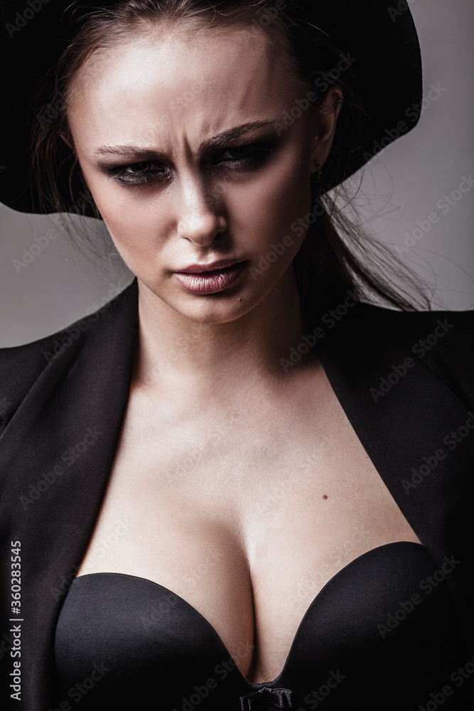 Portrait of sensuous frowning young woman