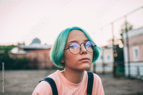 Portrait of teenage girl standing outdoors photo