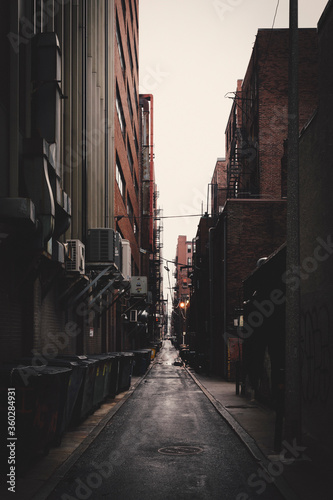 Long alley amidst buildings in city, New York City, New York, USA photo