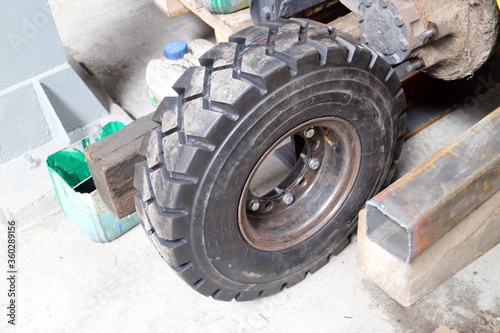 Black wheel loader in hangar