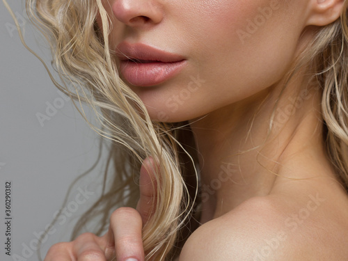 Fototapeta Close-up of woman's Lips with Fashion pink Make-up and Manicure on Nails