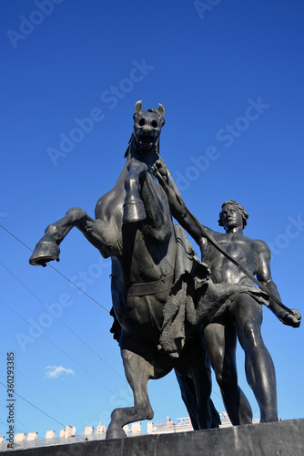 Horse tamers monument by Peter Klodt on Anichkov Bridge in Saint-Petersburg Russia. 