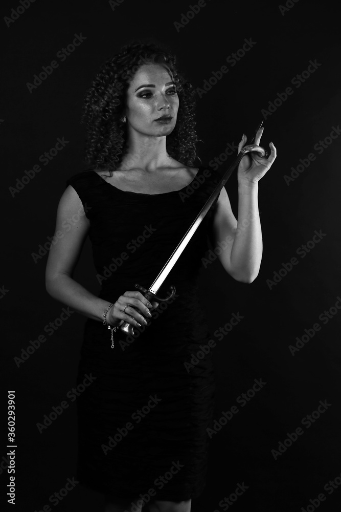 Black-white portrait of a curly girl with a bayonet-knife Black-white portrait of a curly girl with a bayonet-knife