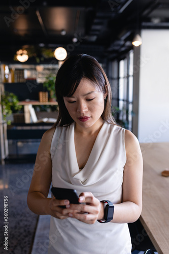 Asian woman using her phone