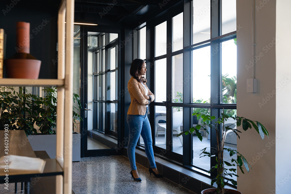 African American business woman looking outside African American business woman looking outside