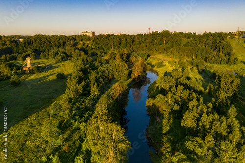 Wallpaper Mural panoramic view of green meadows in the morning haze at sunrise shot from a drone at dawn Torontodigital.ca