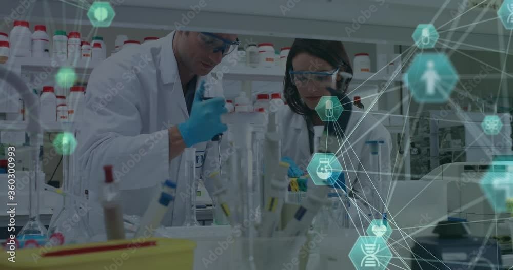 Digital composite video of network of connection with interface medical icons against scientists Digital composite video of network of connection with interface medical icons against scientists