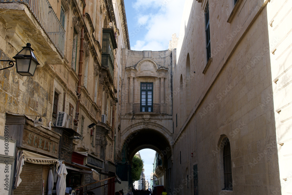 VALLETTA, MALTA - DEC 31st, 2019: Typical narrow cozy street in Valletta, Malta. Old architecture. Traditional maltese architecture
