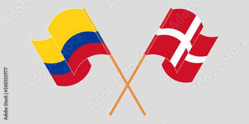 Crossed and waving flags of Colombia and Denmark