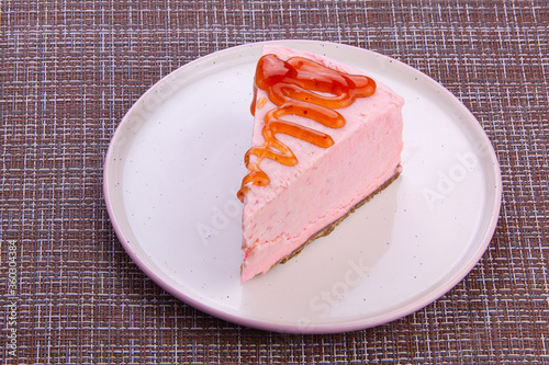 delicious cheesecake with strawberries on  plate photo