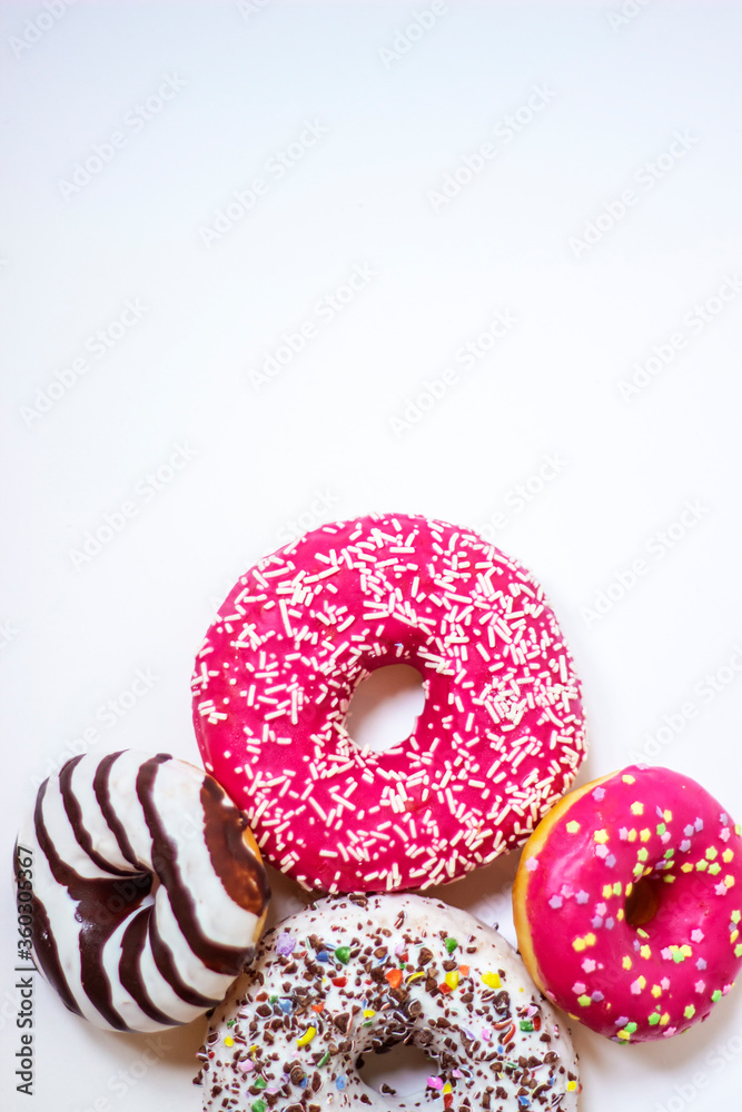 Top view of four donuts on white background. Glazed donuts or doughnuts set - various colors and tastes 3d rendering. Cute, colorful and glossy donuts with glaze and powder. Top view of four donuts on white background. Glazed donuts or doughnuts set - various colors and tastes 3d rendering. Cute, colorful and glossy donuts with glaze and powder.