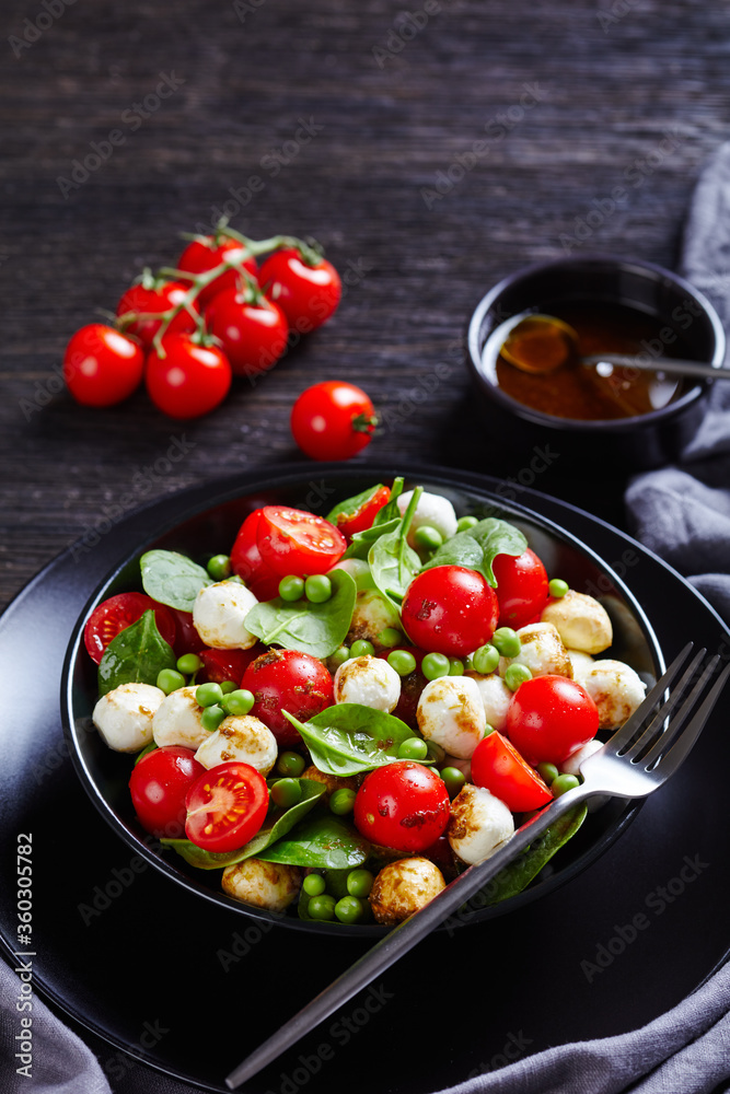 Italian caprese salad with peas and baby spinach Italian caprese salad with peas and baby spinach