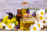 Mixed herbal oil. Essential oil various. Colorful flowers.