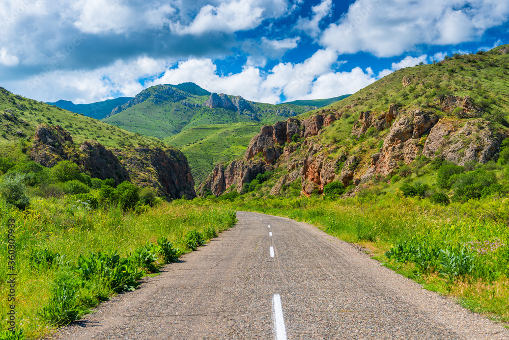 road near Noravank monastery surrounded by picturesque red mountains, Armenia
