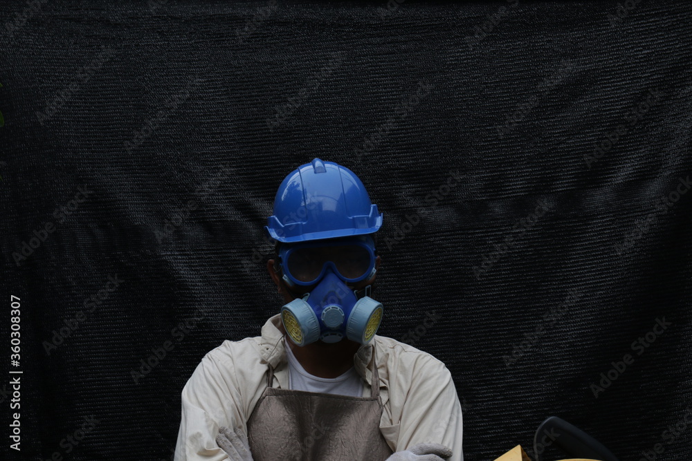 A Man at Work , wearing Blue Safety Helmet 