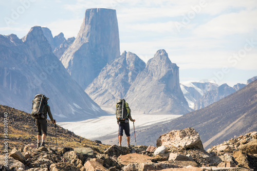 Rear view of backpackers approaching Mount Asgard, Akshayak Pass.