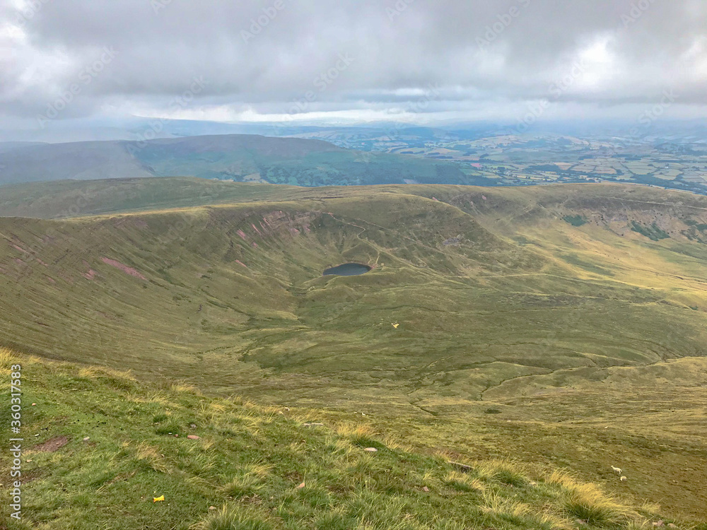 Fototapeta premium Llyn Cwm Llwch is the best preserved glacial lake in South Wales and sits right at the head of the Cwm Llwch valley part of the Brecon Beacons Site of Special Scientific Interest.
