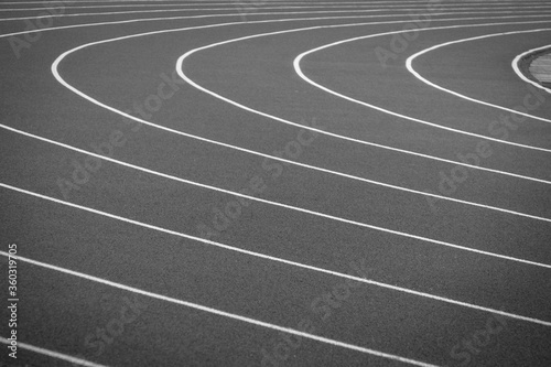 Empty track at a large stadium. Black and white horizontal background