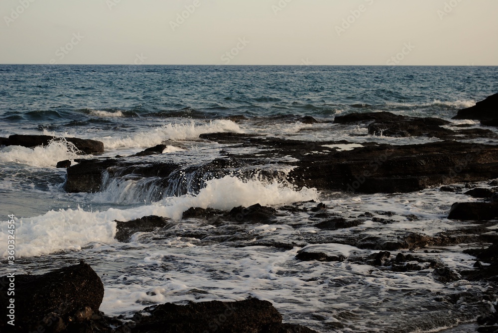 waves breaking on the rocks waves breaking on the rocks