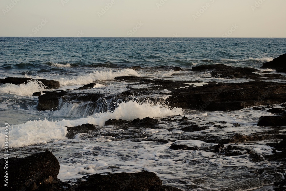 waves breaking on the rocks