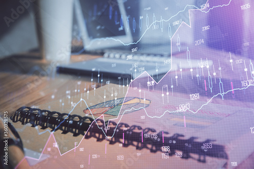 Wallpaper Mural Double exposure of financial graph drawings and desk with open notebook background. Concept of forex market Torontodigital.ca