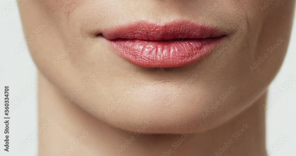 Close up of beauty woman lips, nude colors. Sexy lips Close up of beauty woman lips, nude colors. Sexy lips