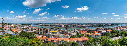 A wide panoramic pic of the city of Budapest Hungary with the Danube river running through it