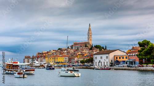 A pic of Rovinj on a cloudy day with boats in the water