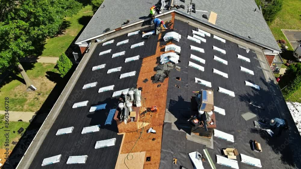 East Brunswick NJ US. 20 JUNE 2020: Roofer repair replace shingle that has been damaged and needing replacement