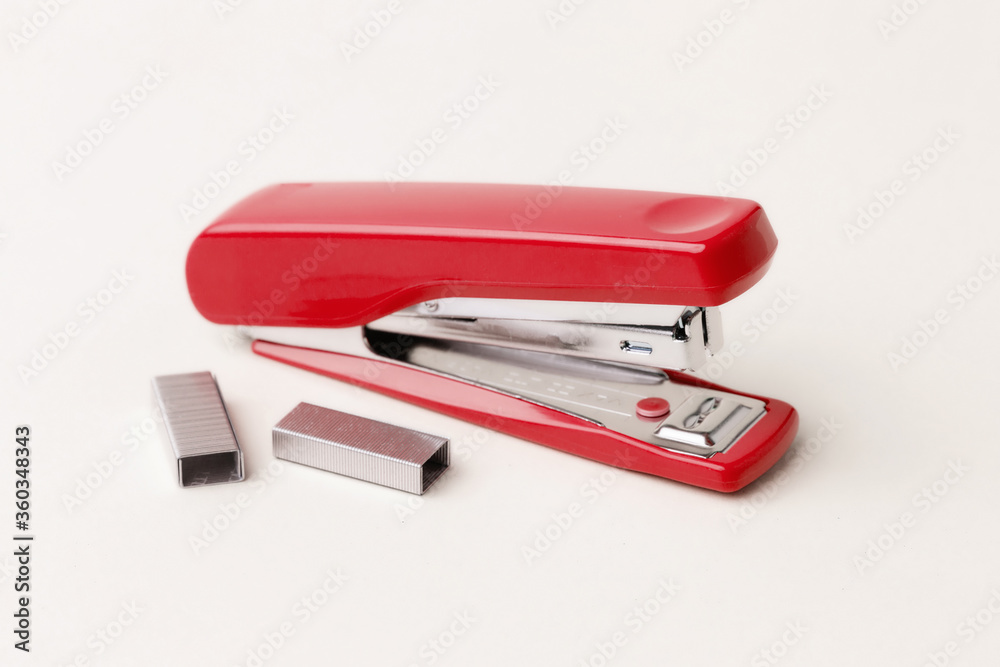 Red stapler on a white background. Red stapler on a white background.