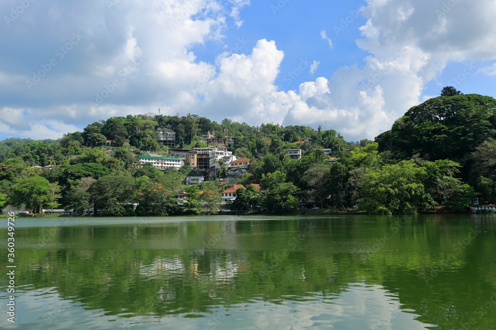 Kandy, Sri Lanka - Kandy Lake and a view from the city. The famous tooth temple is in this city. It is also the old capital of Sri Lanka.