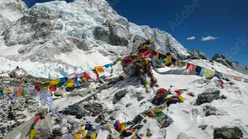 Traditional Nepalese flags waving in wind at the Everest Base Camp in the Himalaya, Nepal. Himalaya landscape and mountain views.
