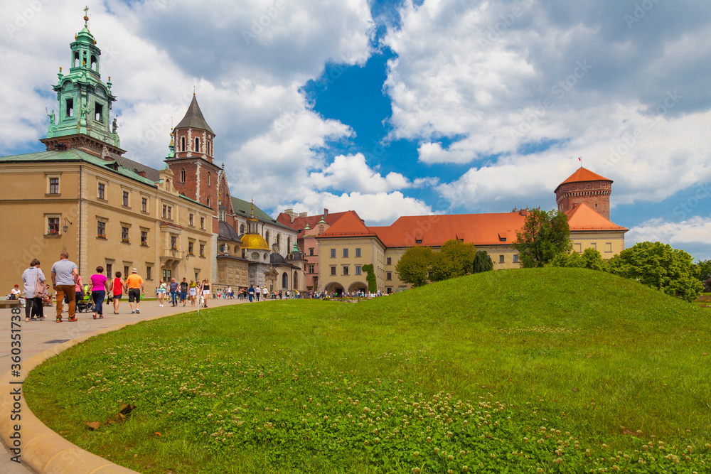 KRAKOW, POLAND, June 02, 2020: Tourists walk around the Royal Castle