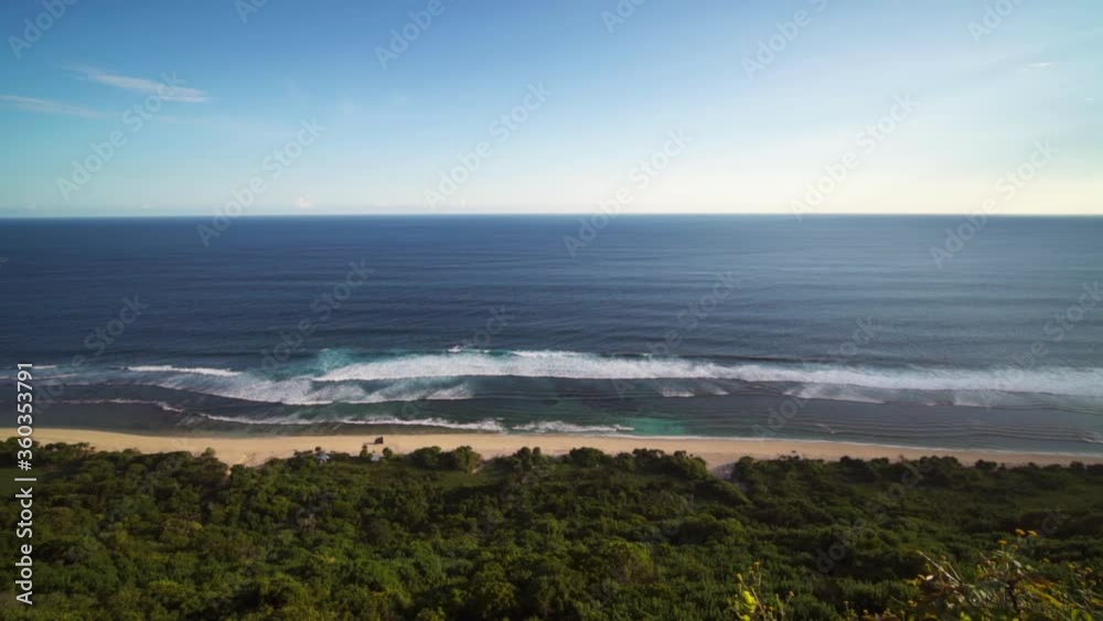 Beautiful Aerial View of Empty Ocean Beach Abstract Waves Turquoise Clean Water White Sand Green Hill Indonesian Tropical Island of Bali Indonesia Beautiful Aerial View of Empty Ocean Beach Abstract Waves Turquoise Clean Water White Sand Green Hill Indonesian Tropical Island of Bali Indonesia