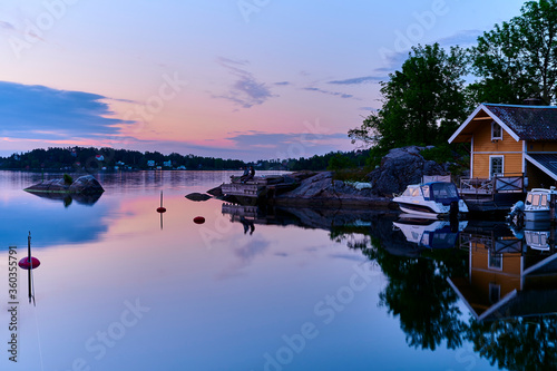 Evening fishing one beautiful evening at a jetty in one of Vaxholm's bays photo
