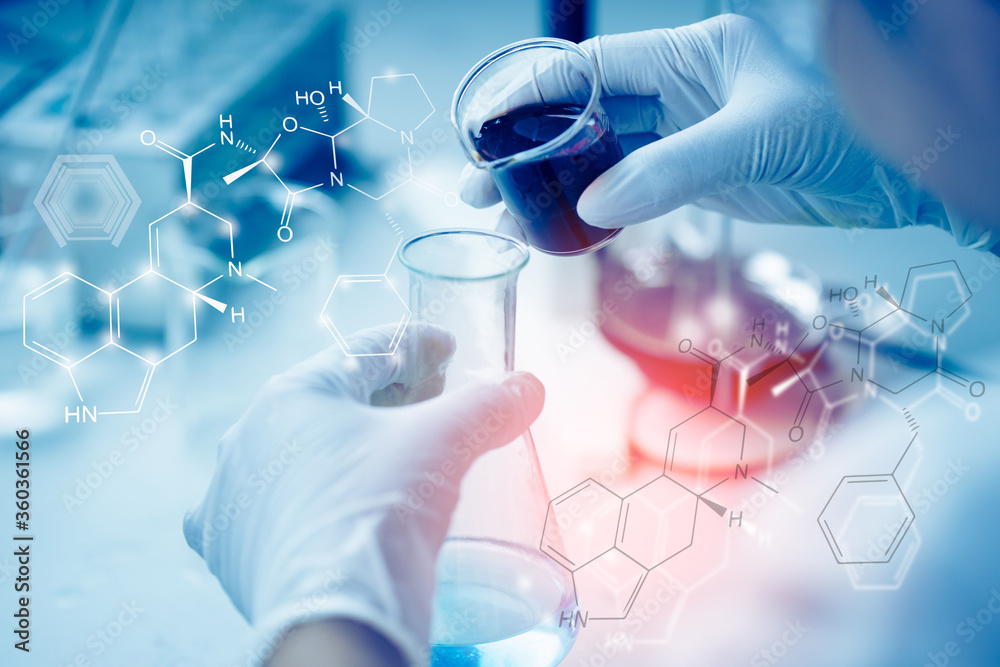 Health care researchers working in life science laboratory. Young female research scientist analyzing microscope slides in research lab. Health care researchers working in life science laboratory. Young female research scientist analyzing microscope slides in research lab.