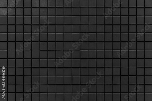 Black mosaic wall pattern and seamless background. Dark ceramic tiles texture background.
