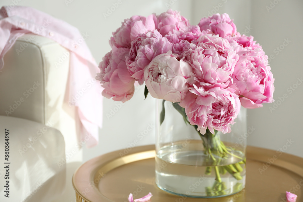 Bouquet of beautiful peonies on table indoors