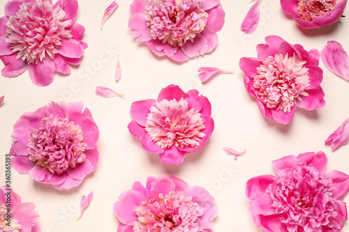 Beautiful fresh peonies on beige background, flat lay