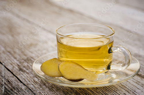 Ginger tea isolated on wood table background .