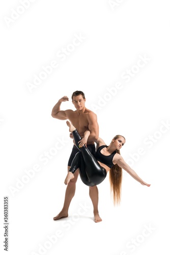 Young couple doing acrobatics isolated shot
