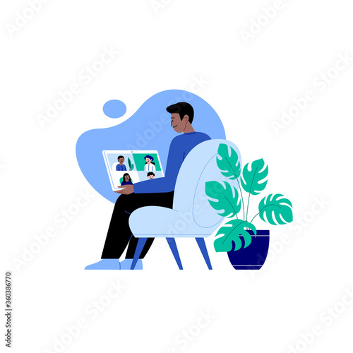 A man staying home meeting up with work team or friends online via conference video call