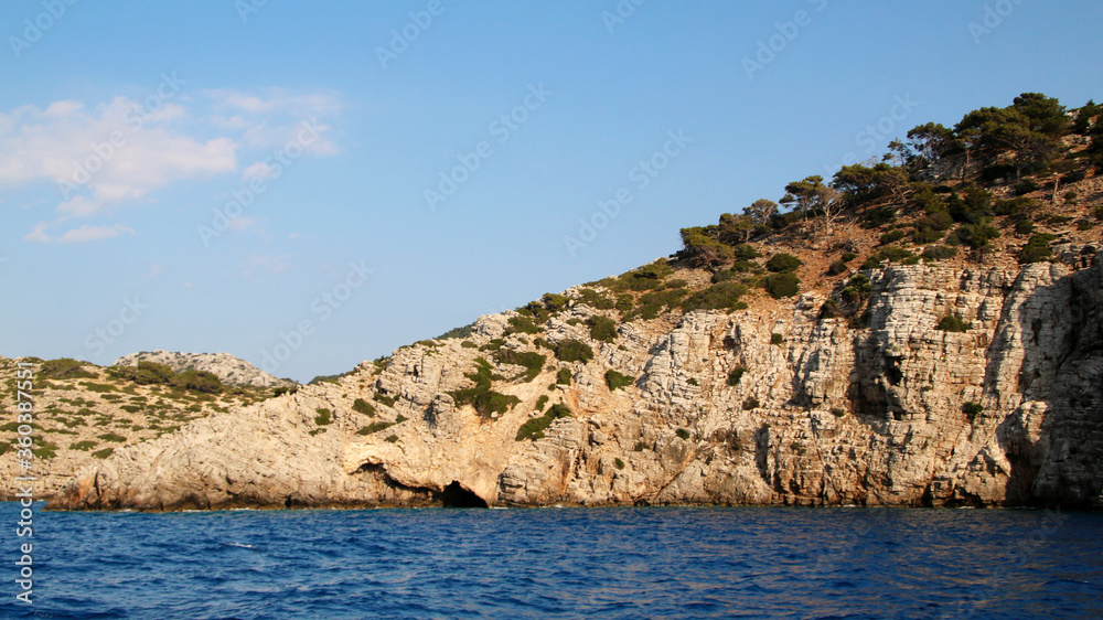 Symi island, rocky seashore, the Aegean Sea, Greece Symi island, rocky seashore, the Aegean Sea, Greece
