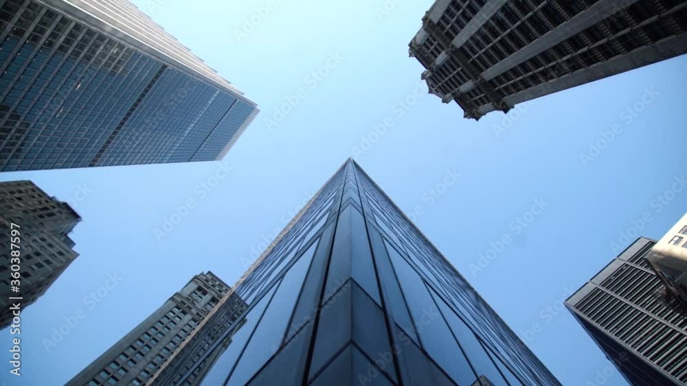 Cinematic slow motion shot of high enterprise buildings in New York City Cinematic slow motion shot of high enterprise buildings in New York City