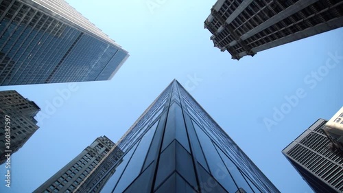 Cinematic slow motion shot of high enterprise buildings in New York City photo