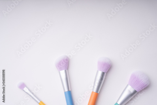 Top view - Pastel rainbow colourful brush isolate over white background.