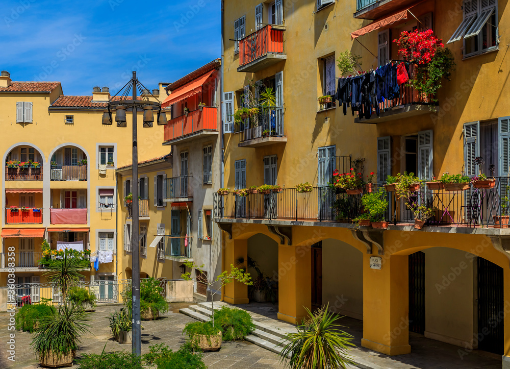 Old traditional houses and a courtyard in the Old Town Vielle Ville in Nice in the South of France