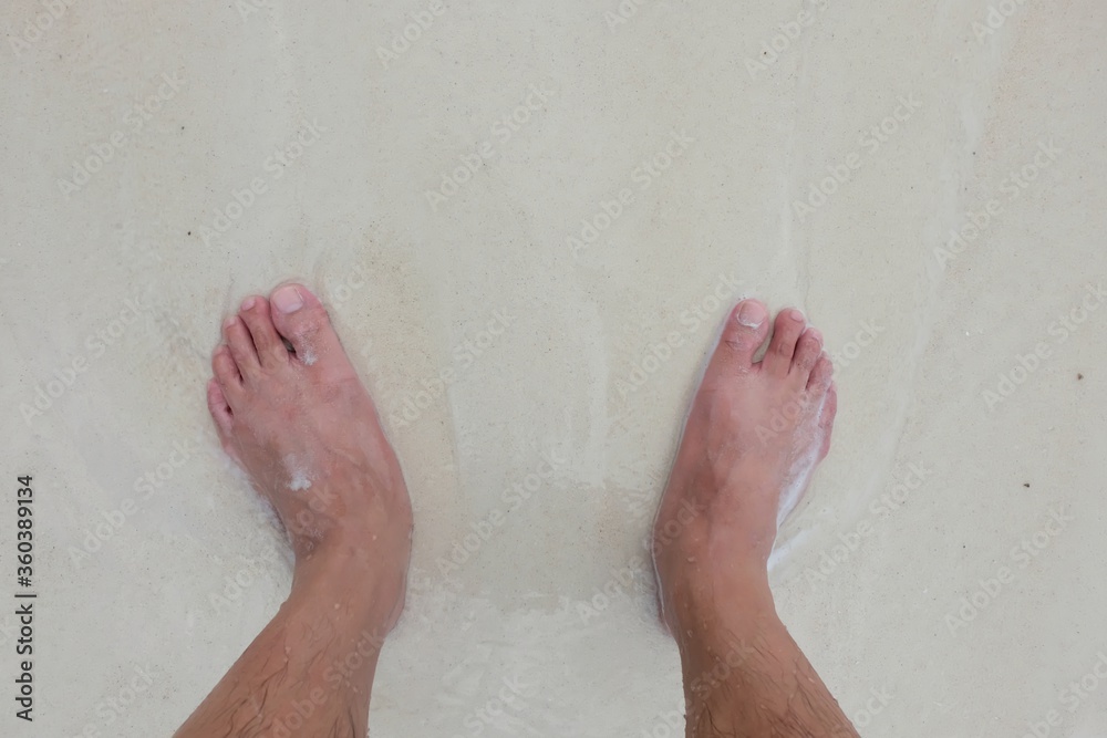 Fototapeta premium bare feet of a young man